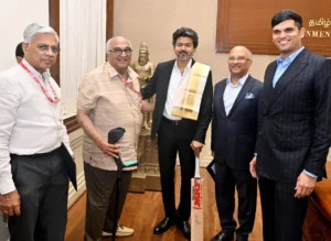 Tamil Nadu CM Vijay Meets MRF Officials, Holds Kohli-Signed Bat at Secretariat